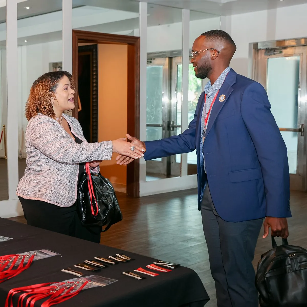 CRAF members shaking hands at Summit 26