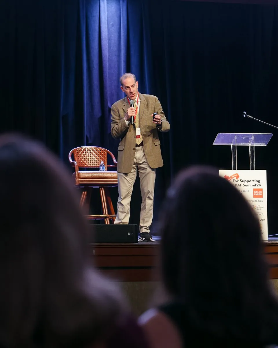 Joshua B. Silver on stage at Summit 26