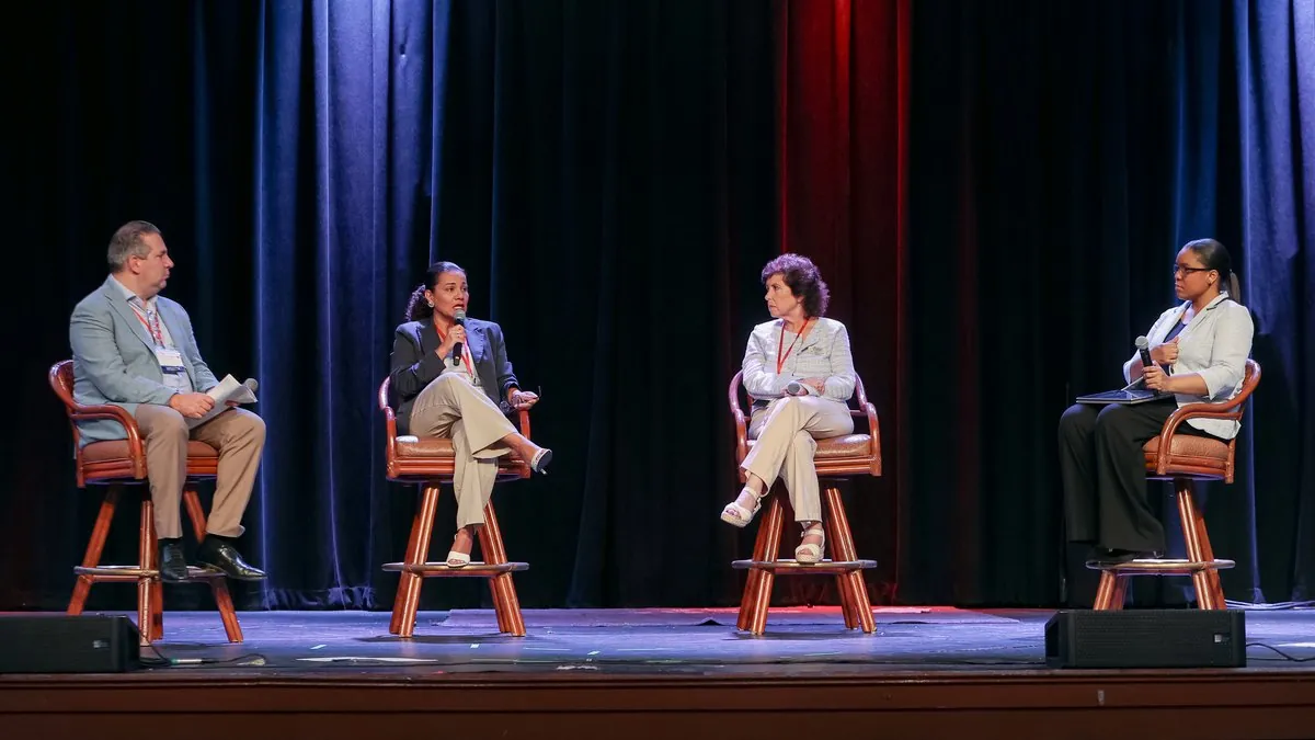 The Social Impact Investing & CBOs panel on stage at Summit 26